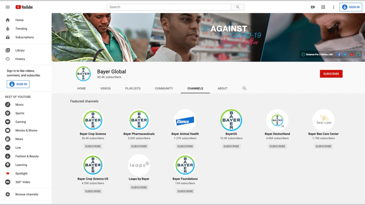 YouTube channel page for Bayer Global, displaying featured channels like Bayer Crop Science, Bayer Pharmaceuticals, and others. The header image features people and text reading "AGAINST COVID-19.