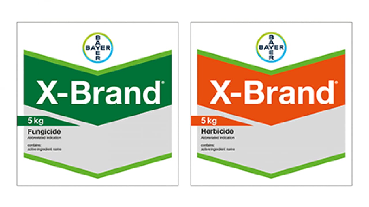 Two packages of X-Brand products: one green labeled as fungicide and one orange labeled as herbicide, each weighing 5 kg, with Bayer logos at the top.