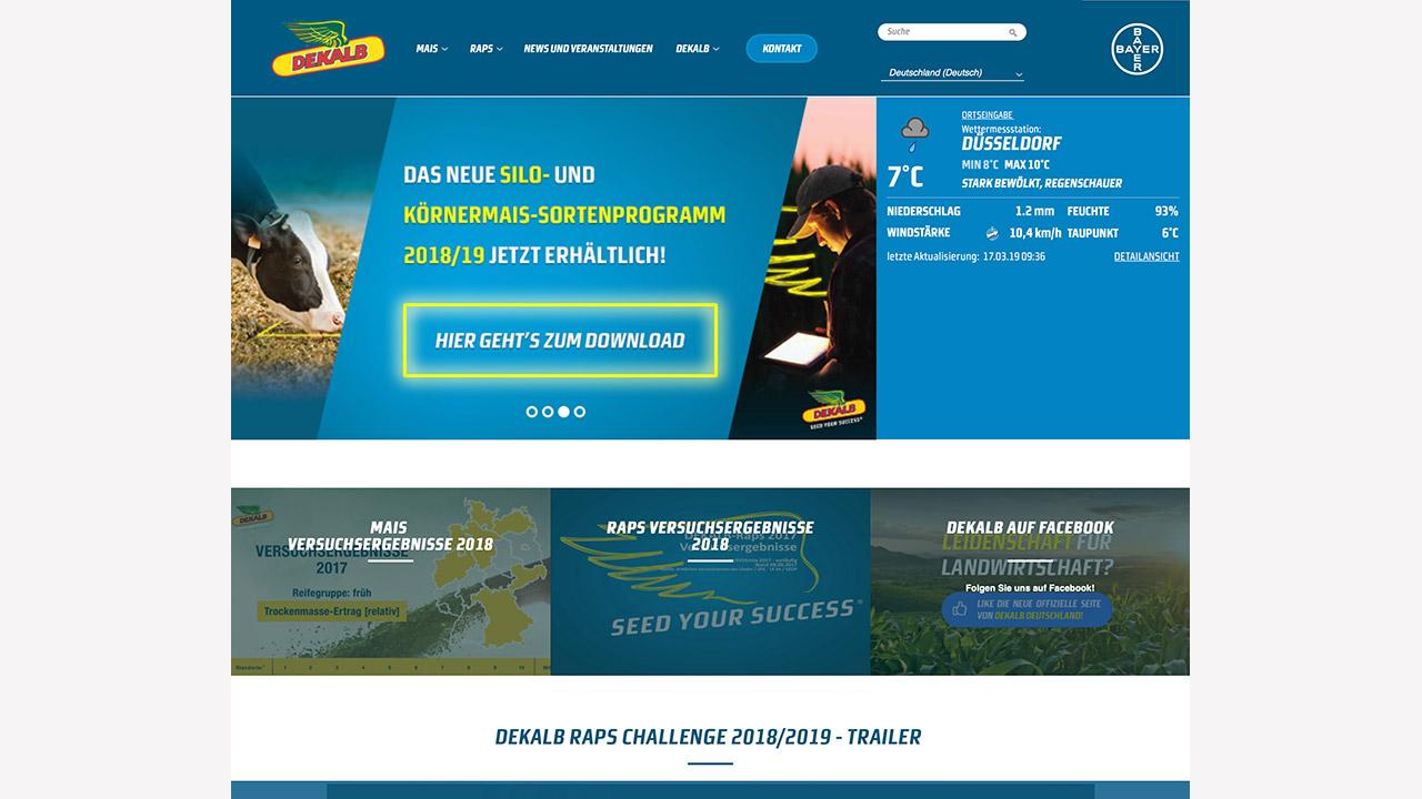 Website homepage featuring agricultural product information, seed program promotion for 2018/19, weather widget for Düsseldorf, and links to videos and Facebook content.