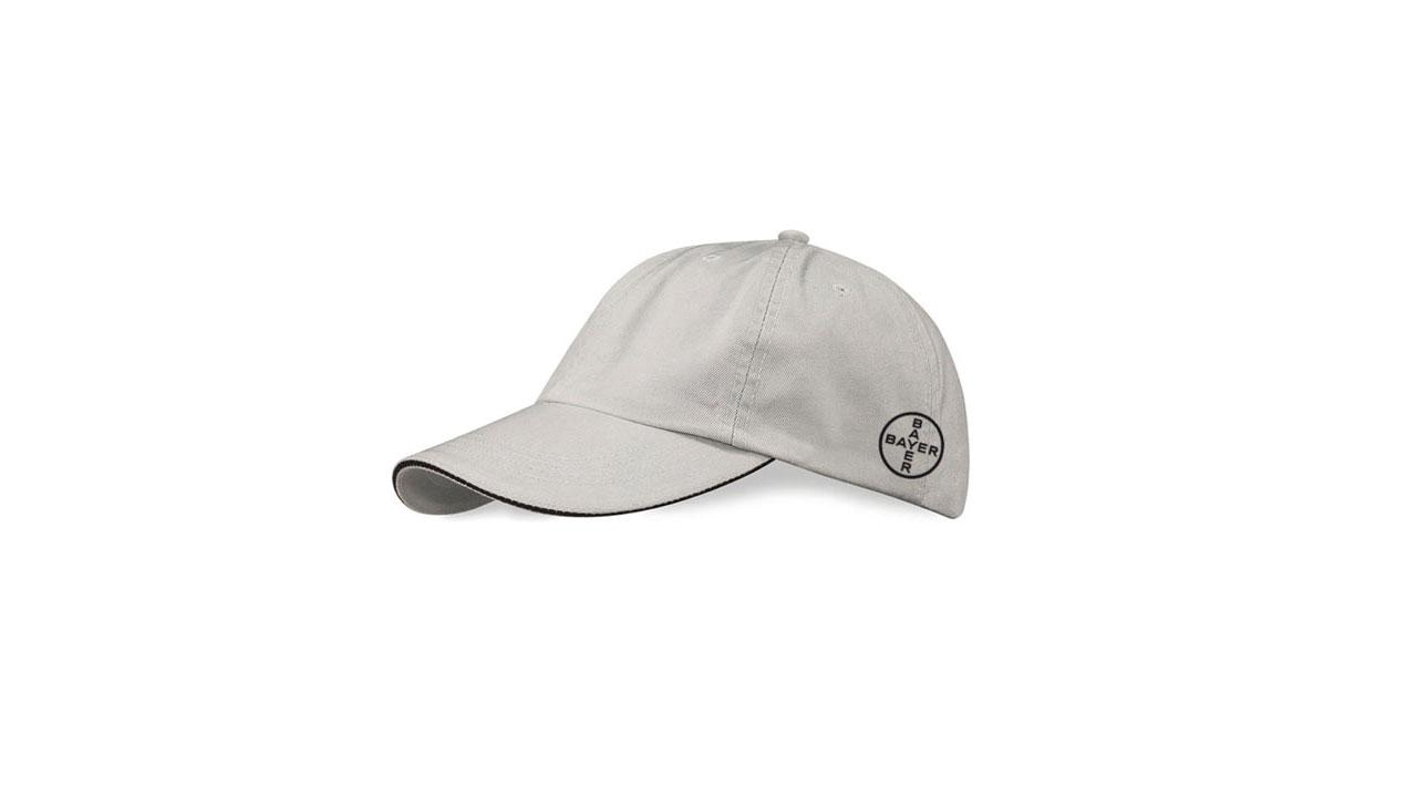 A gray baseball cap with a circular logo on the side, featuring ventilation holes and a curved brim.