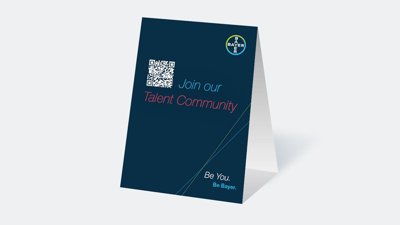 A folded card with a QR code and the text "Join our Talent Community. Be You. Be Bayer." with the Bayer logo at the top.