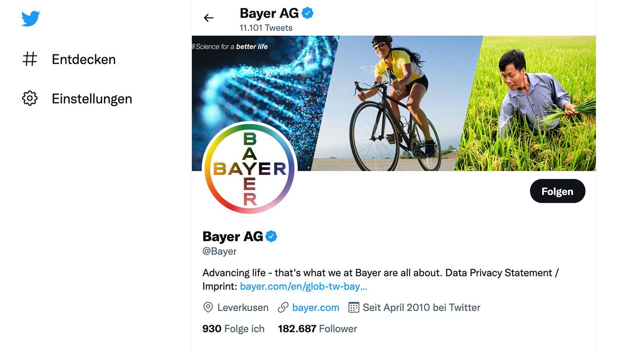 Bayer AG Twitter profile displaying header images of DNA, cycling, and agriculture, with the Bayer logo. The profile includes a description and links.