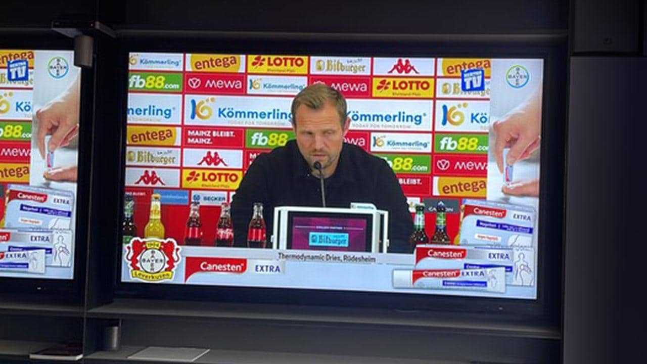Football press conference with Canesten advertising