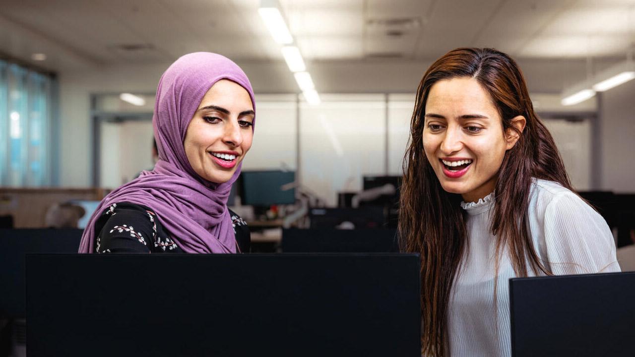 Employees at monitor