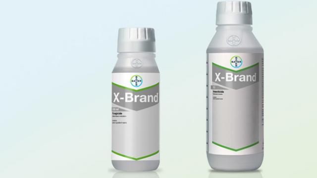 Two bottles of X-Brand pesticide with silver caps and green accents on a light blue background.