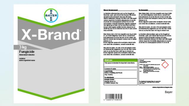 Packaging of Bayer X-Brand fungicide, showing front label with product name and weight, and back label with instructions and safety information.