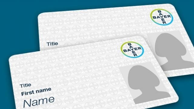 Mock-up of two Bayer ID cards, featuring placeholders for title, first name, and photo, with the Bayer logo in the top right corner.