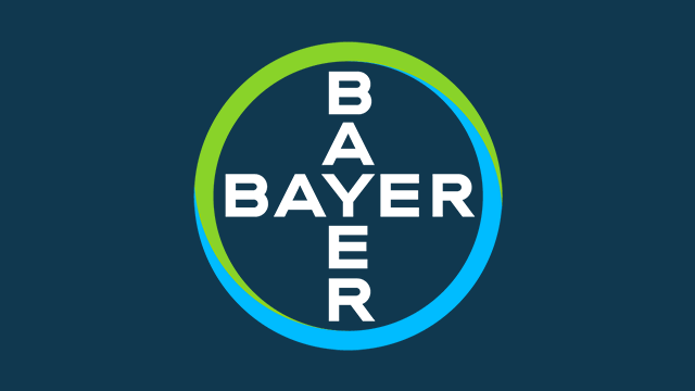 Bayer logo featuring the word "BAYER" intersecting vertically and horizontally within a green and blue circle on a dark background.