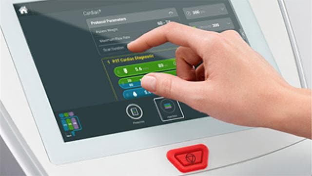 A hand interacts with a touchscreen displaying medical device settings and options, including flow rate and duration. A red emergency stop button is visible below the screen.
