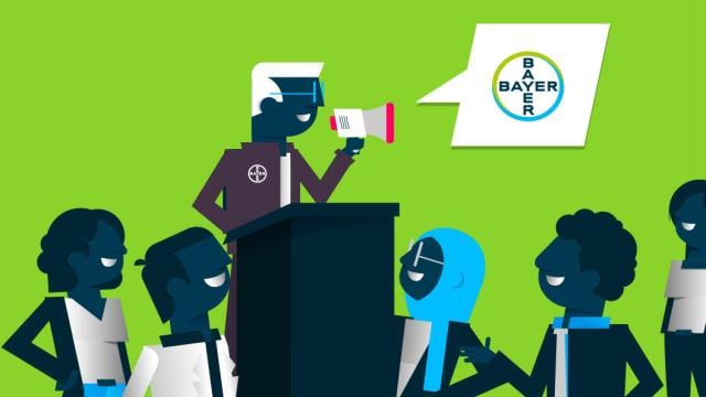 Graphic with speaker at the lectern and audience.