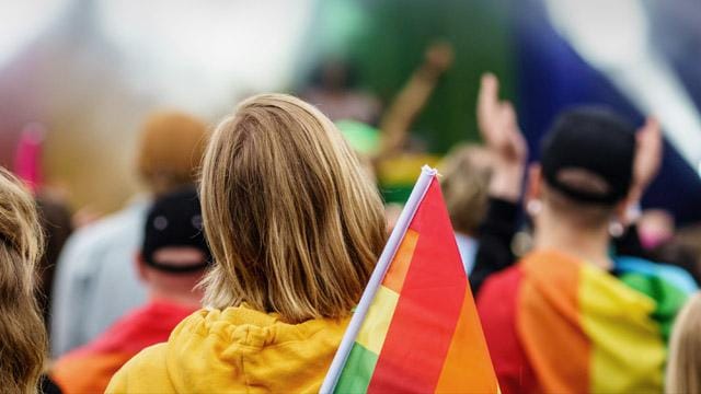 People with rainbow flags