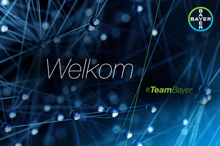 Welkom sign with blue network graphic in the background, Bayer logo at the top right corner, and hashtag #TeamBayer.