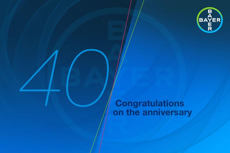Blue background with the number "40" and the Bayer logo. Text reads, "Congratulations on the anniversary.