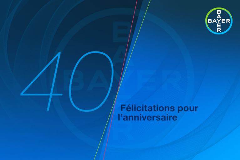 Blue graphic with the number "40" and French text "Félicitations pour l'anniversaire." Bayer logo in the top right corner.