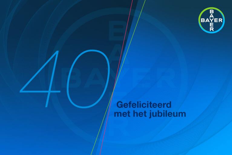 Blue background with the number 40 and the Bayer logo. Text reads, "Gefeliciteerd met het jubileum," which means "Congratulations on the anniversary" in Dutch.