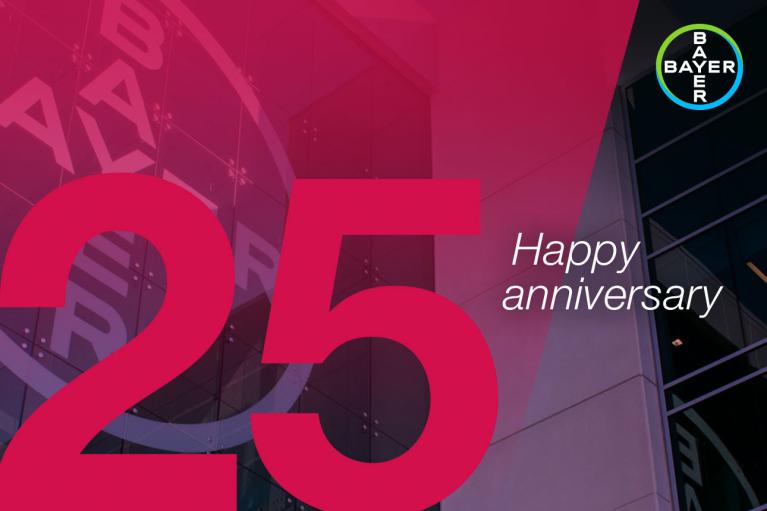 Red and pink graphic with the number "25" and the words "Happy anniversary." Bayer logo in the top right corner.