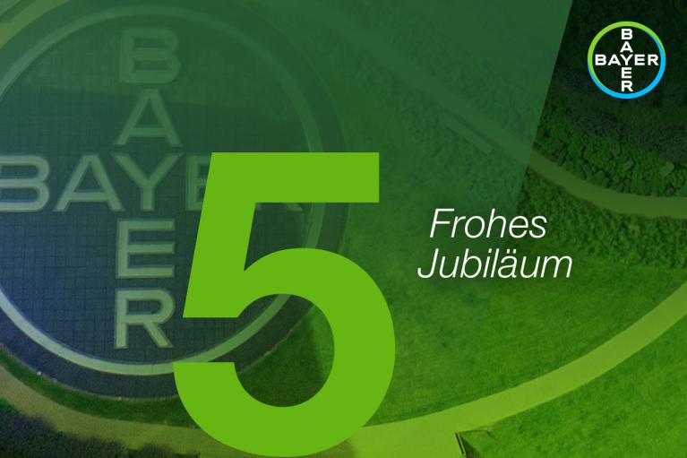 Green and yellow Bayer logo with a large number 5 and the phrase "Frohes Jubiläum" on a green background.
