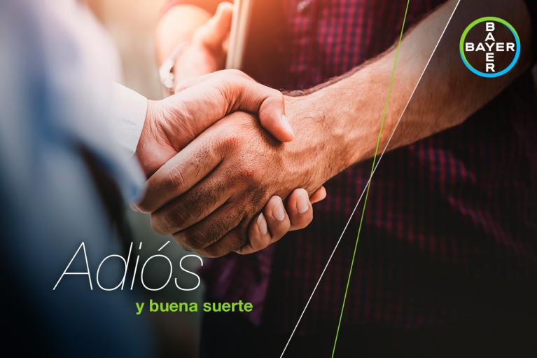 Two people shaking hands with "Adiós y buena suerte" written on the left. The Bayer logo appears in the top right corner.