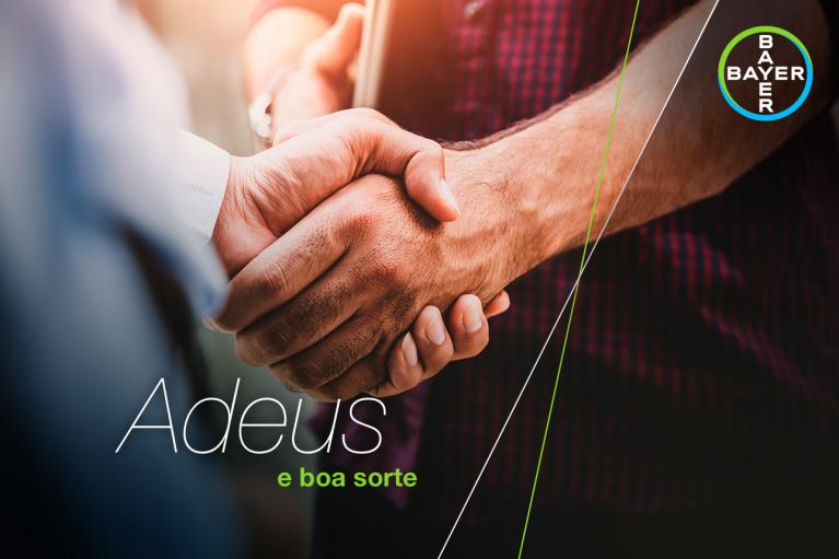 Two people shaking hands, with the text "Adeus e boa sorte" and a Bayer logo in the corner.