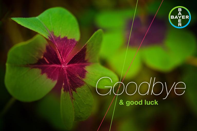 A four-leaf clover with text "Goodbye & good luck" and a Bayer logo in the corner.