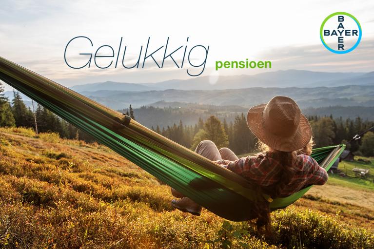 Person relaxing in a hammock on a hill overlooking a forested valley under a clear sky, with "Gelukkig pensioen" and a Bayer logo in the image.