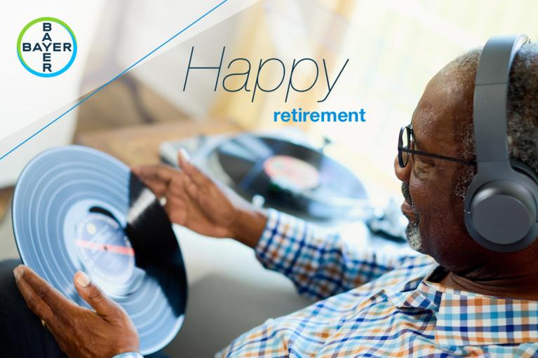 An elderly man listens to vinyl records with headphones. The image includes the text "Happy retirement" and a Bayer logo.