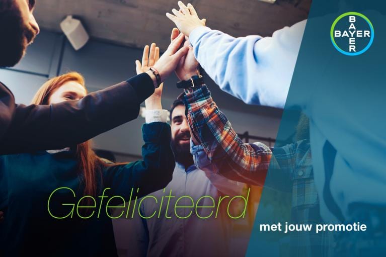 A group of people high-fiving with text "Gefeliciteerd met jouw promotie" and a Bayer logo in the corner.