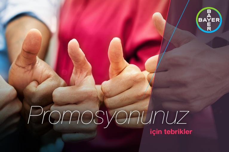 A group of people giving thumbs up with the text "Promosyonunuz için tebrikler" and Bayer logo on the right side.