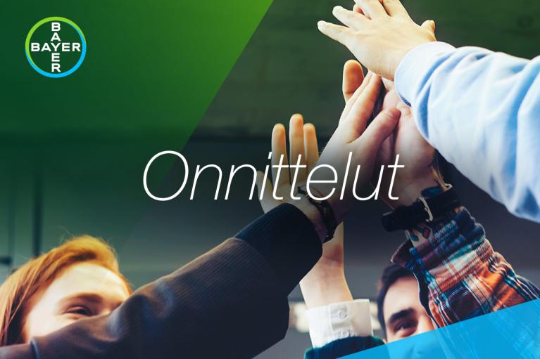 Group with raised hands touching and the word "Onnittelut"