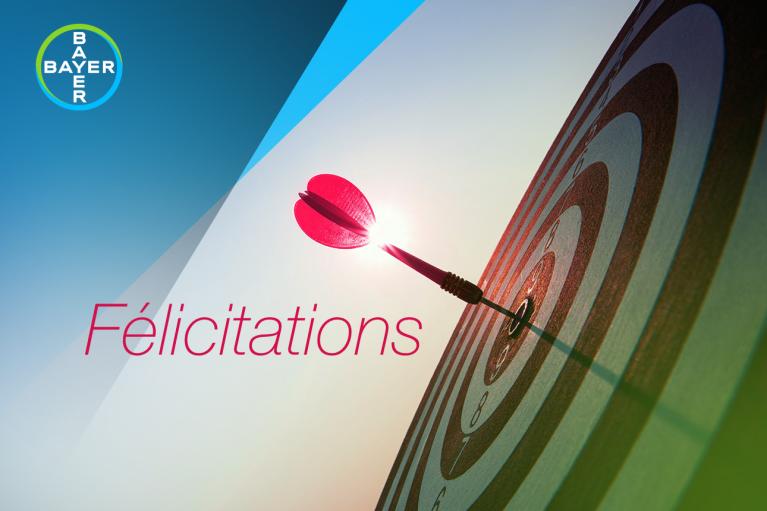 Target with a dart in the center and the word "Félicitations"