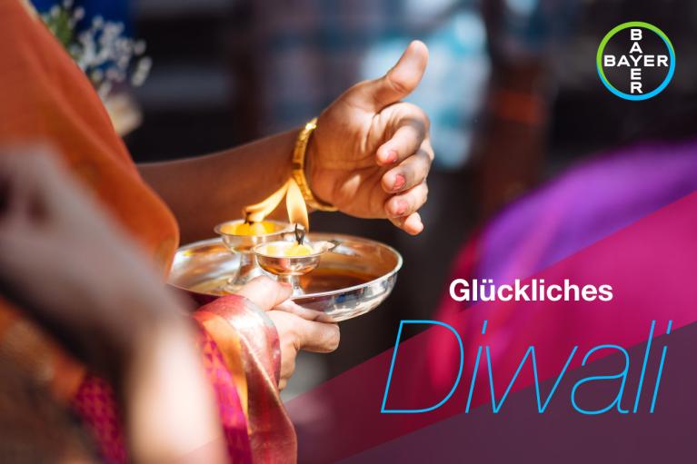 Glückliches Diwali, Candlelight protected by one hand