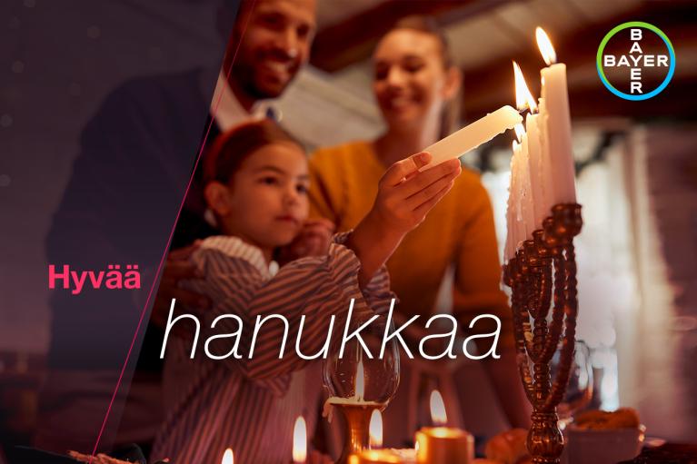 Family looks at Hanukkah candlesticks