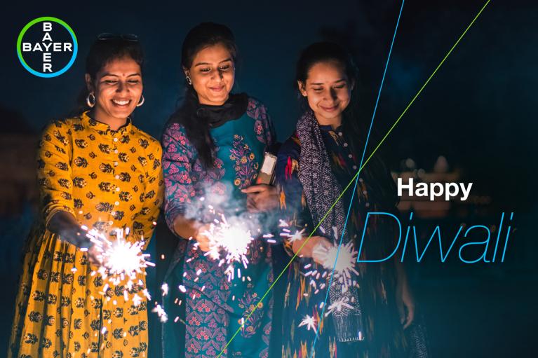 Happy Diwali, three women with sparklers