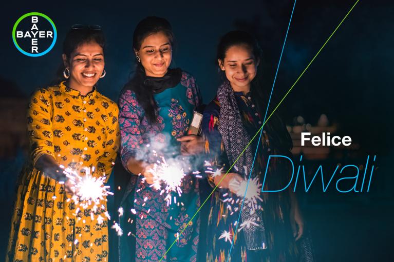 Felice Diwali, three women with sparklers