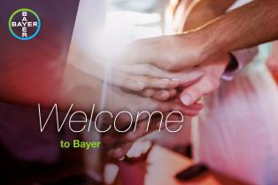 Hands stacked together with "Welcome to Bayer" text overlay and Bayer logo in the corner.