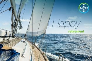 Sailboat on open water with "Happy retirement" text and Bayer logo.