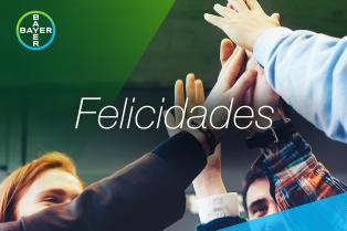 Group with raised hands touching and the word "Felicidades"