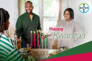 Two women and a man celebrate Kwanzaa